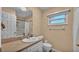 Bright bathroom featuring a single sink vanity and a shower with curtain at 3715 Fortner Rd, Plant City, FL 33567