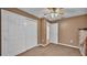 Bedroom with spacious closet and ceiling fan, offering ample storage and comfort at 3715 Fortner Rd, Plant City, FL 33567