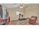 This bonus room has a ceiling fan, wood-look flooring and receives plenty of natural light at 3715 Fortner Rd, Plant City, FL 33567