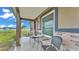 Covered carport seating area with charming outdoor views at 3715 Fortner Rd, Plant City, FL 33567