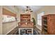 Traditional dining room features vintage furnishings, wood-look floors, and a decorative chandelier at 3715 Fortner Rd, Plant City, FL 33567