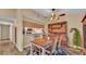 Traditional dining room has vintage furnishings, wood-look floors, and natural lighting at 3715 Fortner Rd, Plant City, FL 33567