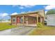 Charming home featuring a long carport and well-maintained lawn at 3715 Fortner Rd, Plant City, FL 33567