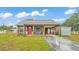 Beautiful home boasts a long carport and well-manicured lawn at 3715 Fortner Rd, Plant City, FL 33567