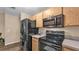 Kitchen features stainless steel appliances including a microwave and stove at 3715 Fortner Rd, Plant City, FL 33567