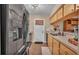 Kitchen boasts modern stainless steel refrigerator and ample cabinet space at 3715 Fortner Rd, Plant City, FL 33567