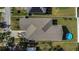 Aerial view of the backyard showing the roof, lawn, and pool at 5227 Lime Ave, Seffner, FL 33584