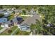 Home featuring sleek solar panels and an immaculate lawn and landscape, perfect for the environmentally conscious homeowner at 5227 Lime Ave, Seffner, FL 33584