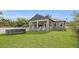 A spacious backyard features a pool and a covered porch at 5227 Lime Ave, Seffner, FL 33584