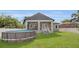 The home features a spacious backyard with an above ground pool and covered porch at 5227 Lime Ave, Seffner, FL 33584