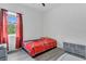 Simple bedroom with a window, small wardrobe, and bed featuring a Spiderman themed comforter at 5227 Lime Ave, Seffner, FL 33584