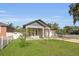 Inviting single-story home boasting a green lawn and attached two-car garage at 5227 Lime Ave, Seffner, FL 33584