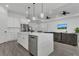 Bright, open kitchen with a large island, white cabinets, and seamlessly connects to the living room at 5227 Lime Ave, Seffner, FL 33584