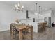 Spacious open floor plan with kitchen island, barstool seating and a dining area at 5227 Lime Ave, Seffner, FL 33584