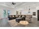 Spacious living room featuring a sectional couch, plush armchair, and modern decor at 5227 Lime Ave, Seffner, FL 33584