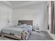 Cozy bedroom featuring a stylish headboard, neutral decor, and soft lighting at 5227 Lime Ave, Seffner, FL 33584