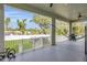 Covered patio with outdoor seating, hammock, and view of fenced yard with above ground pool, perfect for entertaining at 5227 Lime Ave, Seffner, FL 33584