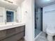 Updated bathroom featuring modern vanity with double sinks, and glass-enclosed shower at 6350 92Nd N Pl # 2206, Pinellas Park, FL 33782