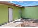 Exterior shot of a charming backyard and door at 10804 N Leo St, Tampa, FL 33612