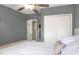 Primary bedroom showcasing an open closet and modern ceiling fan at 10804 N Leo St, Tampa, FL 33612