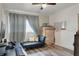 Versatile room with modern futon, desk area, storage, perfect for work or relaxation at 10804 N Leo St, Tampa, FL 33612