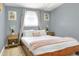 Cozy bedroom featuring a plush bed and decorative art at 10804 N Leo St, Tampa, FL 33612