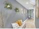 Stylish hallway with decorative plants and pillows, adding a touch of elegance and comfort at 10804 N Leo St, Tampa, FL 33612