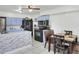 Cozy kitchen with blue cabinets, white countertop island, black appliances, and a dining table at 10804 N Leo St, Tampa, FL 33612