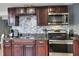 Updated kitchen with stainless steel appliances, granite countertops, and stylish cabinetry at 10804 N Leo St, Tampa, FL 33612