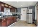 Well-equipped kitchen features stainless steel appliances, granite countertops, and tiled backsplash at 10804 N Leo St, Tampa, FL 33612