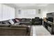 Bright living room features a comfortable sectional sofa and a classic piano at 10804 N Leo St, Tampa, FL 33612