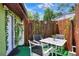 Cozy outdoor seating with garden decor and a privacy fence, perfect for relaxing outdoors at 10804 N Leo St, Tampa, FL 33612
