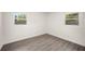 Cozy bedroom featuring gray floors, white walls, and window at 6011 67Th N Ave, Pinellas Park, FL 33781
