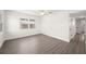 Bright bedroom with gray flooring, a ceiling fan, and neutral walls at 6011 67Th N Ave, Pinellas Park, FL 33781