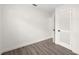 Bedroom showcasing hard surface floors, white walls, and a closet with white door at 6011 67Th N Ave, Pinellas Park, FL 33781