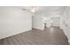 Bright living room featuring new flooring, ceiling fan, and neutral walls at 6011 67Th N Ave, Pinellas Park, FL 33781