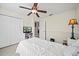 Bedroom featuring a ceiling fan, closet, and neutral decor at 9912 Pine Leaf Ln, Dade City, FL 33525