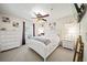 Bright bedroom with a ceiling fan, and matching decor at 9912 Pine Leaf Ln, Dade City, FL 33525
