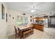 Eat-in kitchen with stainless steel appliances and adjacent dining area at 9912 Pine Leaf Ln, Dade City, FL 33525