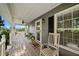 Inviting front porch with rocking chair and charming decor, perfect for relaxing at 9912 Pine Leaf Ln, Dade City, FL 33525