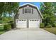 Two-car garage with an upstairs loft with ample parking and storage space at 9912 Pine Leaf Ln, Dade City, FL 33525