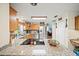 Open concept kitchen featuring granite countertops and modern appliances at 9912 Pine Leaf Ln, Dade City, FL 33525
