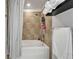 This bathroom features tile backsplash and a bathtub at 101 S 12Th St # 318, Tampa, FL 33602