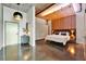 Modern bedroom features unique wood slat detail, concrete floors, and large windows at 101 S 12Th St # 318, Tampa, FL 33602