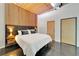 This bedroom features a bed with built-in side tables, wood floors and modern lighting at 101 S 12Th St # 318, Tampa, FL 33602