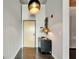 A stylish entryway with a modern light fixture, a console table, and a door leading to the interior at 101 S 12Th St # 318, Tampa, FL 33602