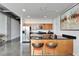Modern kitchen features wood cabinets, stainless steel appliances, granite counters, and an island with bar seating at 101 S 12Th St # 318, Tampa, FL 33602