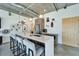 A contemporary kitchen island with bar seating, stainless steel appliances, and stylish pendant lighting at 101 S 12Th St # 318, Tampa, FL 33602