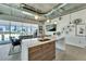 A modern kitchen with bar seating, stainless steel appliances, and a view of the city skyline at 101 S 12Th St # 318, Tampa, FL 33602