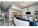 Open-concept living room boasts a modern kitchen, industrial-style ceilings, and contemporary furnishings at 101 S 12Th St # 318, Tampa, FL 33602